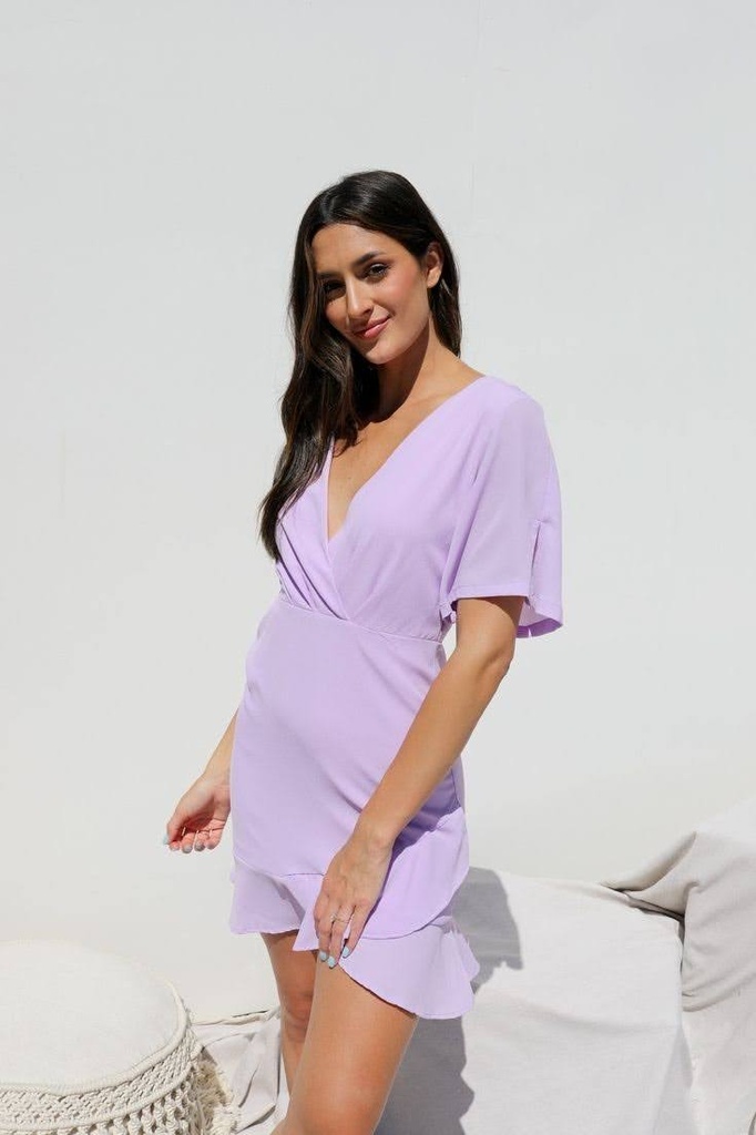 Northline Lavender Bliss V-Neck Ruffle Mini Dress combines elegance and charm with its flattering wrap-style bodice, flutter sleeves, and playful ruffle hem. Perfect for any occasion, this dress adds a touch of sophistication in a beautiful lavender hue.