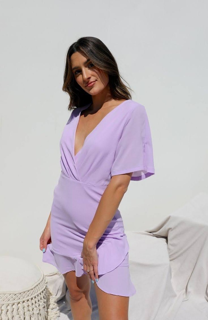 Northline Lavender Bliss V-Neck Ruffle Mini Dress combines elegance and charm with its flattering wrap-style bodice, flutter sleeves, and playful ruffle hem. Perfect for any occasion, this dress adds a touch of sophistication in a beautiful lavender hue.