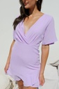 Northline Lavender Bliss V-Neck Ruffle Mini Dress combines elegance and charm with its flattering wrap-style bodice, flutter sleeves, and playful ruffle hem. Perfect for any occasion, this dress adds a touch of sophistication in a beautiful lavender hue.